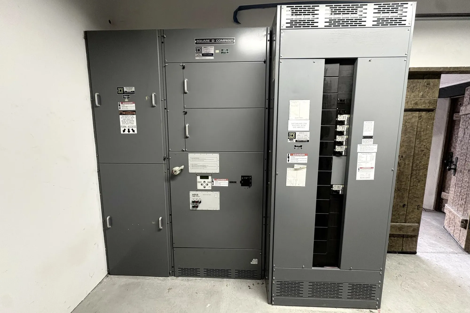 Commercial switchgear and distribution sections in a Bay Area building electrical room